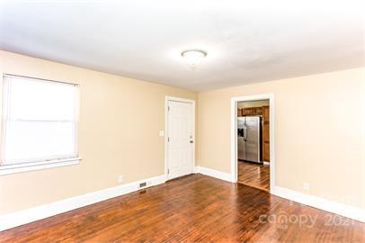 1714 Club Road, Unit 6 Charlotte, NC 28205 - Photo 7 of 14 a view of empty room with wooden floor