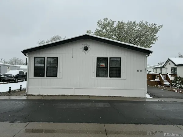 a front view of a house with garage