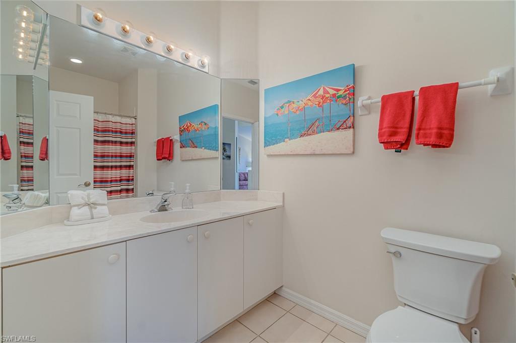 20151 Seagrove Street, Unit 207 Estero, FL 33928 - Photo 14 of 22 a bathroom with a sink a toilet and a shower