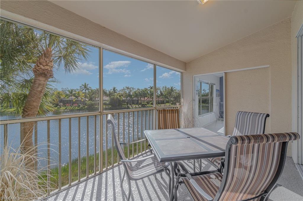 20151 Seagrove Street, Unit 207 Estero, FL 33928 - Photo 15 of 22 a view of balcony with furniture and wooden deck