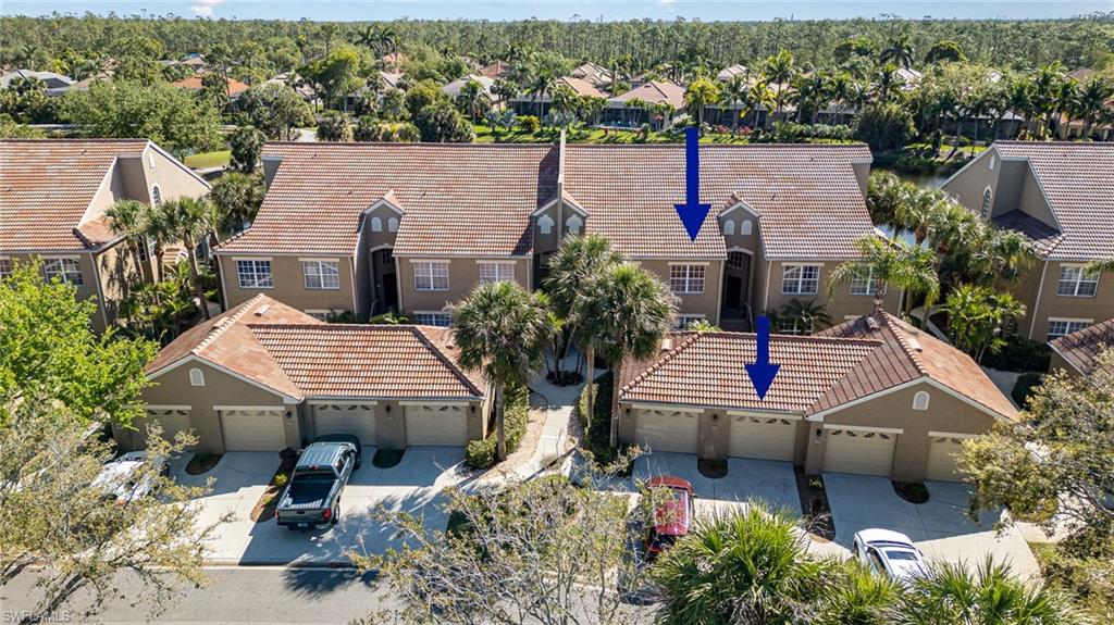 20151 Seagrove Street, Unit 207 Estero, FL 33928 - Photo 17 of 22 an aerial view of a house with swimming pool and lake view