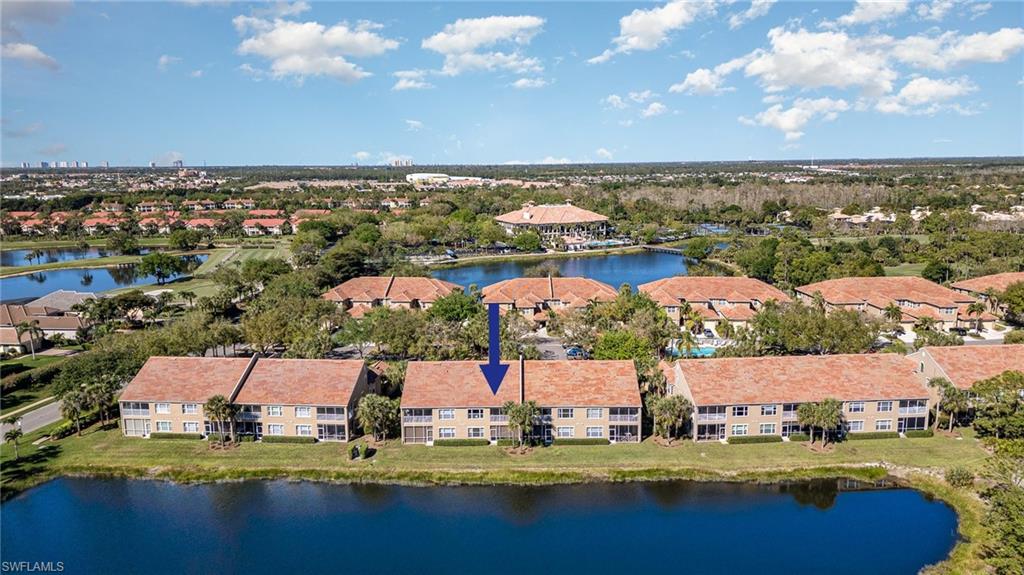 20151 Seagrove Street, Unit 207 Estero, FL 33928 - Photo 19 of 22 an aerial view of residential houses with outdoor space
