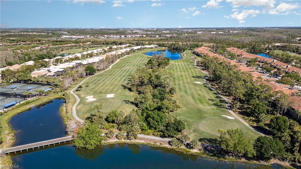 20151 Seagrove Street, Unit 207 Estero, FL 33928 - Photo 21 of 22 an aerial view of ocean and residential houses with outdoor space