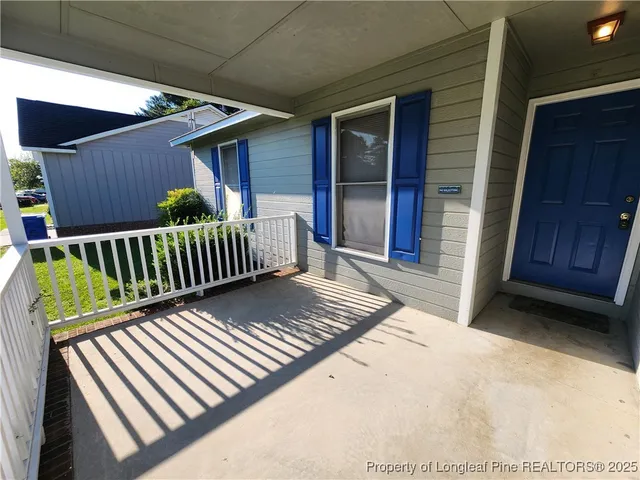 a view of a backyard with a deck