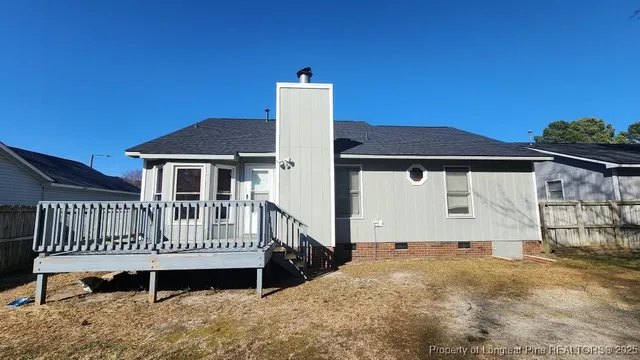 a roof deck with a yard and plants