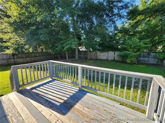 a view of a wooden deck with a large window