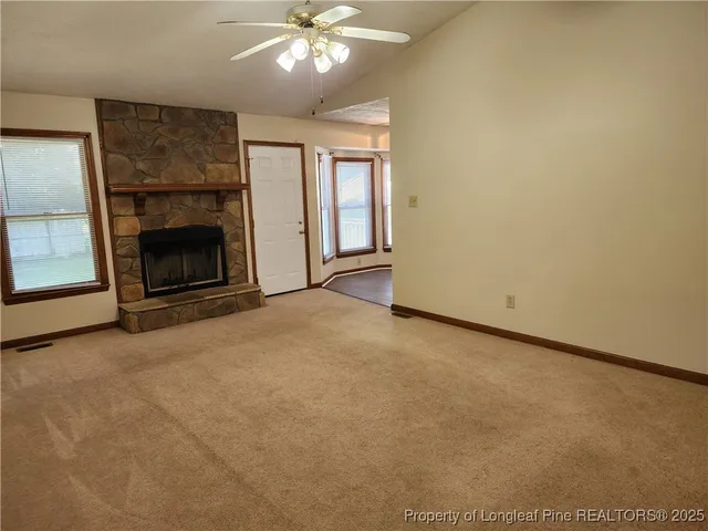 an empty room with a fireplace