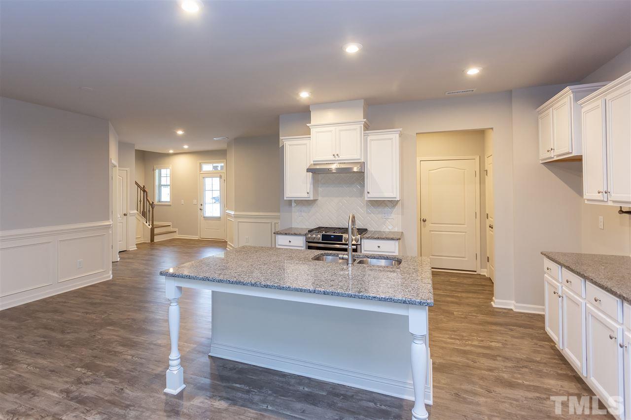 400 Piazza Way Wake Forest, NC 27587 - Photo 2 of 25 a kitchen with a refrigerator and a sink