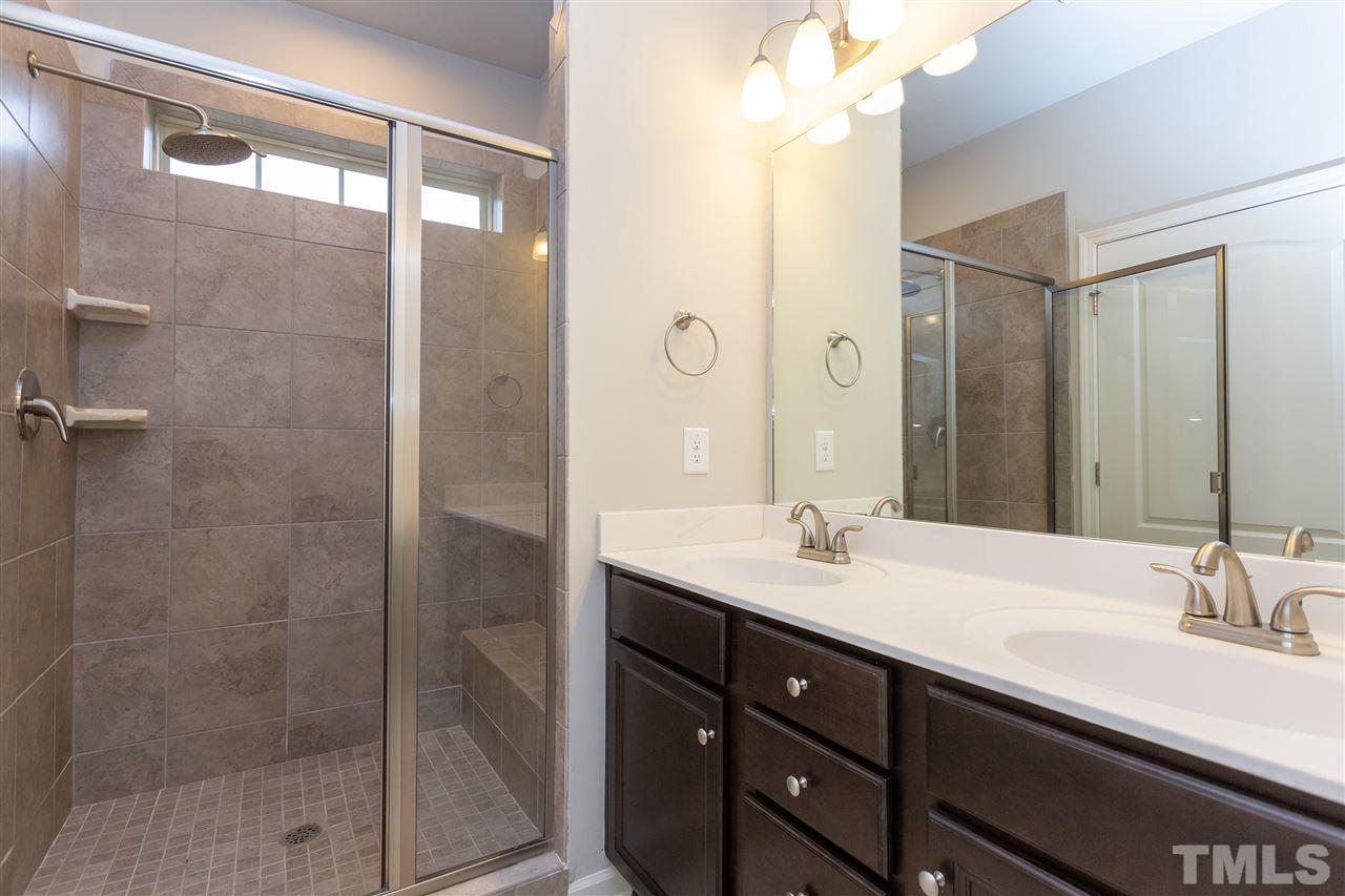 400 Piazza Way Wake Forest, NC 27587 - Photo 11 of 25 a bathroom with a double vanity sink mirror and shower