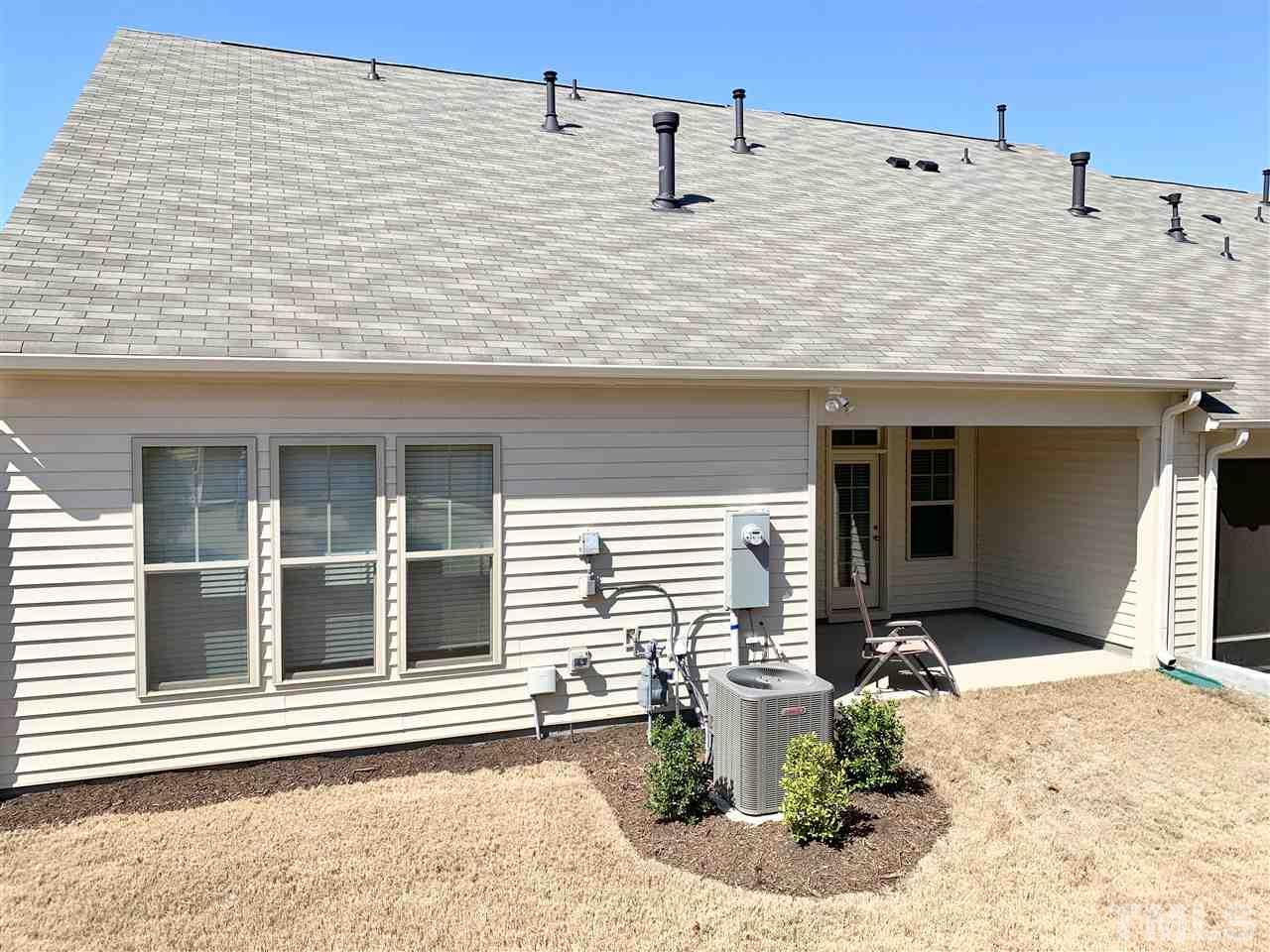 400 Piazza Way Wake Forest, NC 27587 - Photo 24 of 25 a front view of a house with outdoor seating