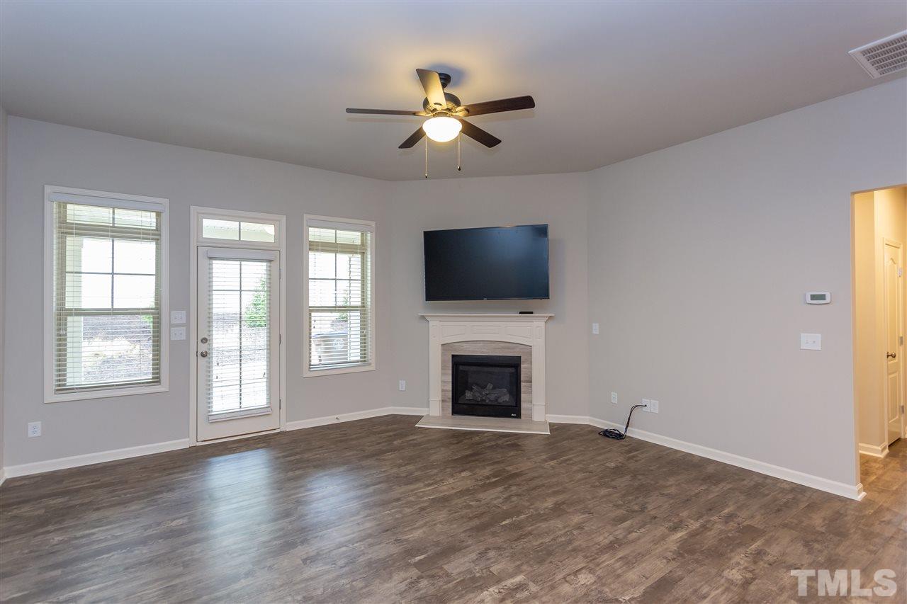 400 Piazza Way Wake Forest, NC 27587 - Photo 4 of 25 a view of livingroom window fireplace and windows