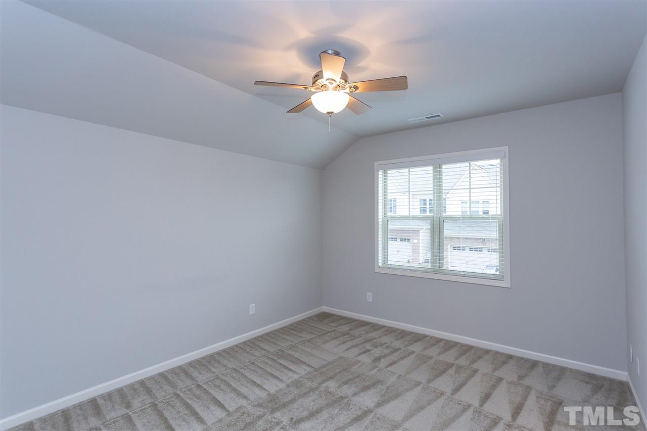 400 Piazza Way Wake Forest, NC 27587 - Photo 10 of 25 a view of an empty room with a window