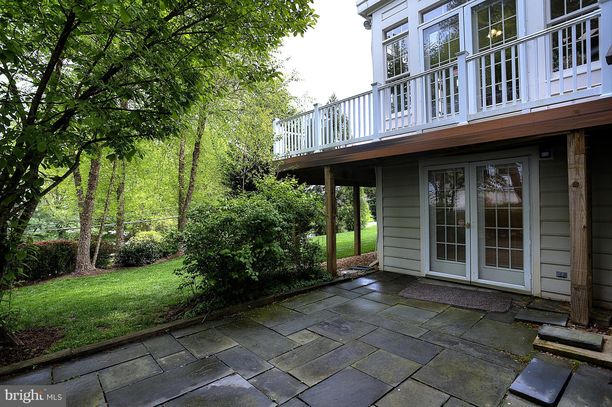 8154 Ridge Creek Way Springfield, VA 22153 - Photo 27 of 30 Exterior(Side)-Slate patio with deck above