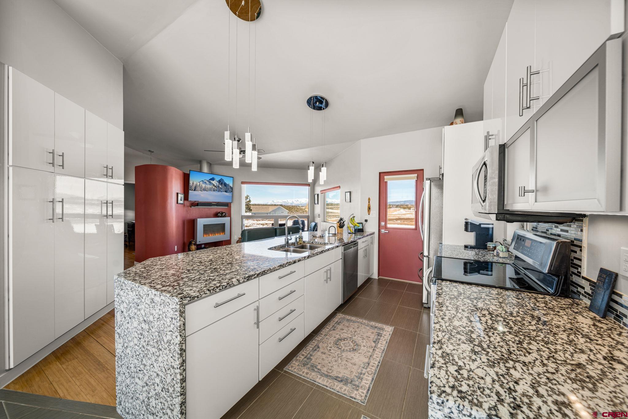 59 Chesterfield Place Ignacio, CO 81137 - Photo 12 of 35 a kitchen with stainless steel appliances granite countertop a sink stove and refrigerator