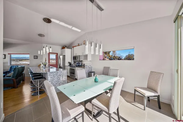 a view of a dining room with furniture