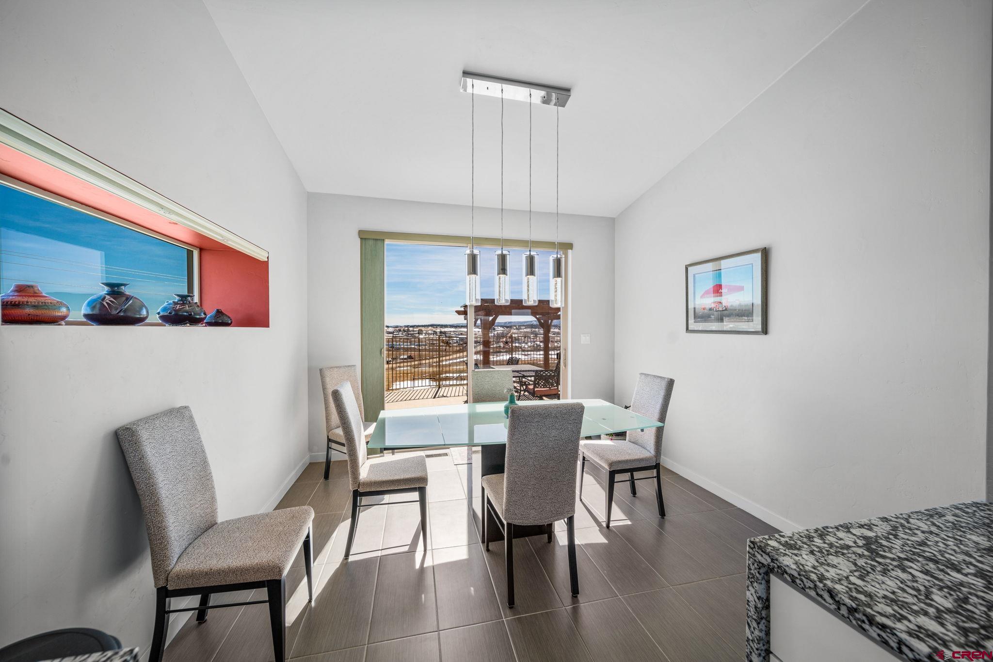 59 Chesterfield Place Ignacio, CO 81137 - Photo 16 of 35 a view of a dining room with furniture window and wooden floor
