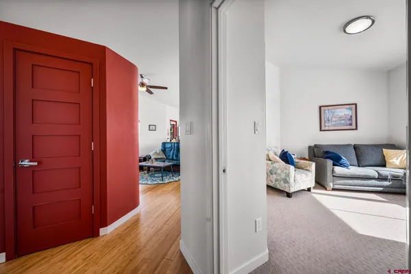 a bedroom with furniture and a chandelier