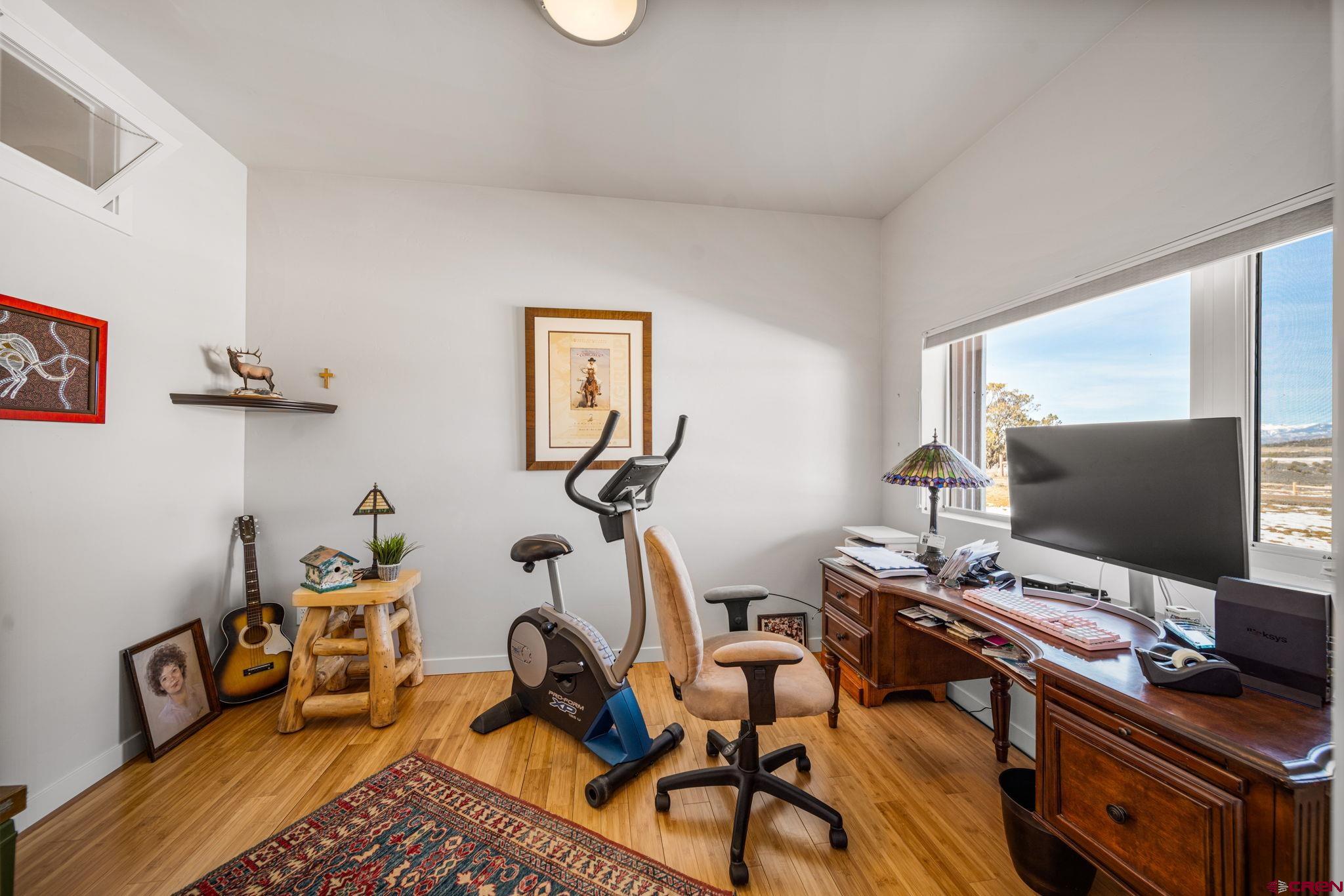 59 Chesterfield Place Ignacio, CO 81137 - Photo 24 of 35 a view of a workspace with furniture and a window