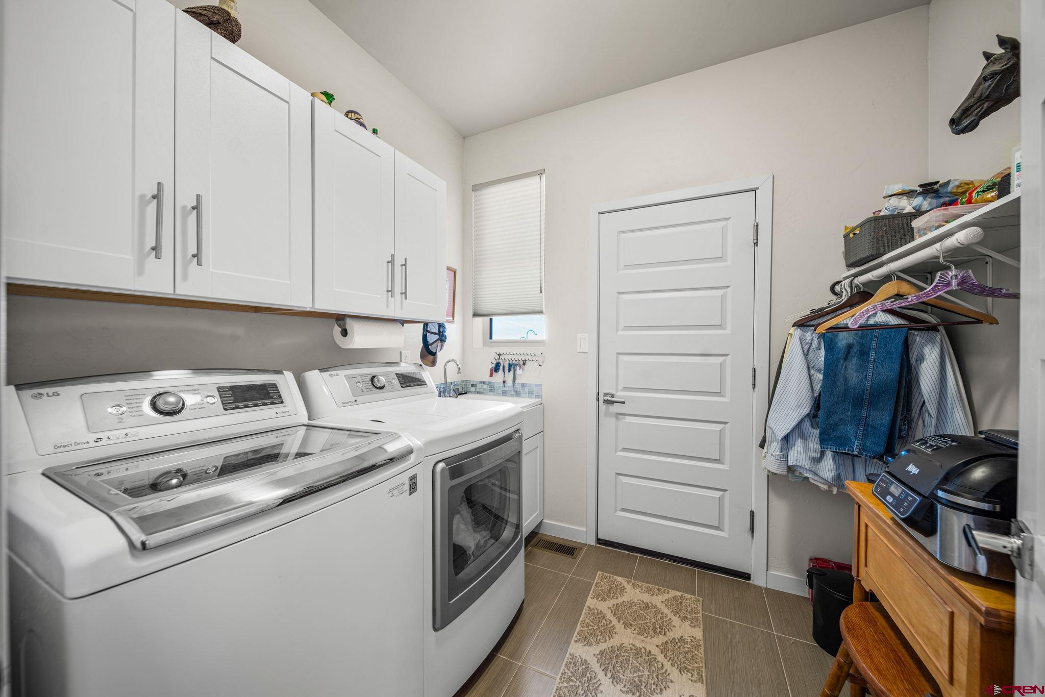 59 Chesterfield Place Ignacio, CO 81137 - Photo 27 of 35 a view of storage and utility room with washer and dryer