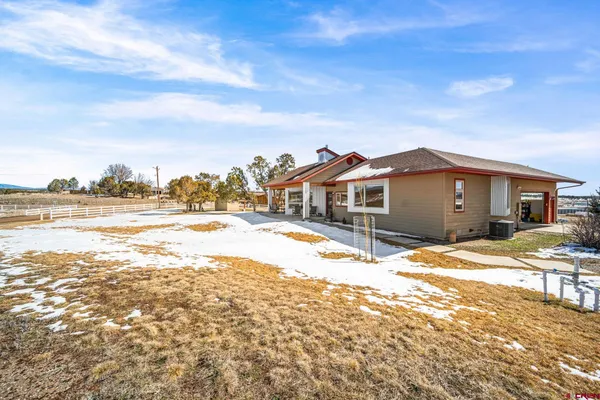 a view of swimming pool with a house in the background