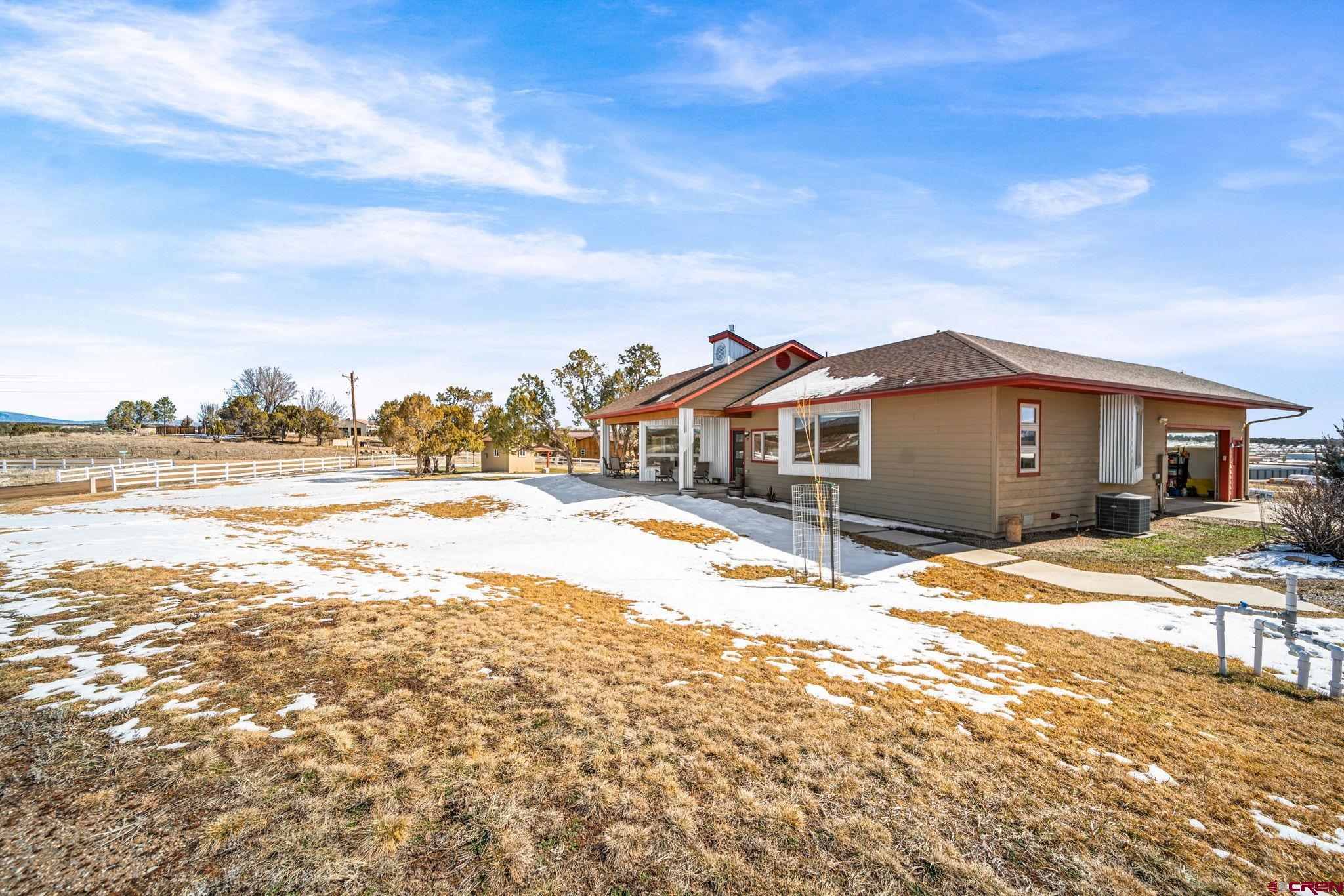 59 Chesterfield Place Ignacio, CO 81137 - Photo 4 of 35 a view of swimming pool with a house in the background