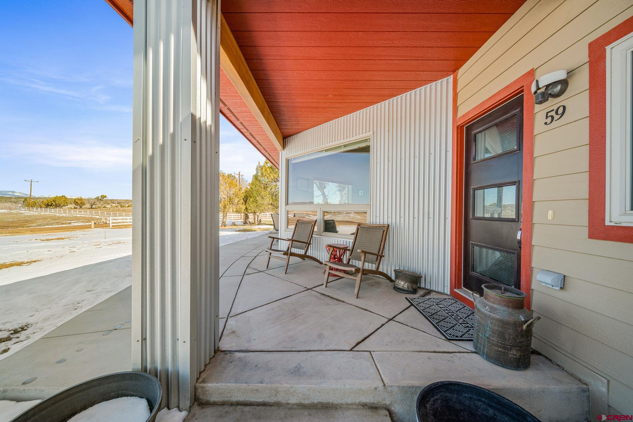 59 Chesterfield Place Ignacio, CO 81137 - Photo 7 of 35 a building outdoor space with patio furniture and potted plants