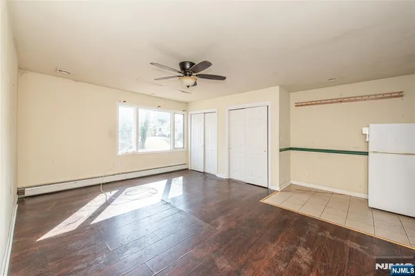 a view of an empty room with a window