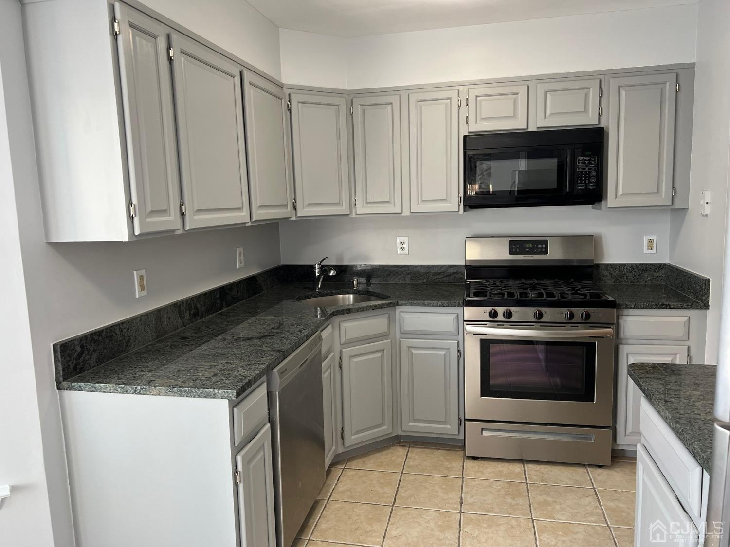 1201 Jesse Way Piscataway, NJ 08854 - Photo 1 of 11 a kitchen with stainless steel appliances granite countertop a sink and a stove