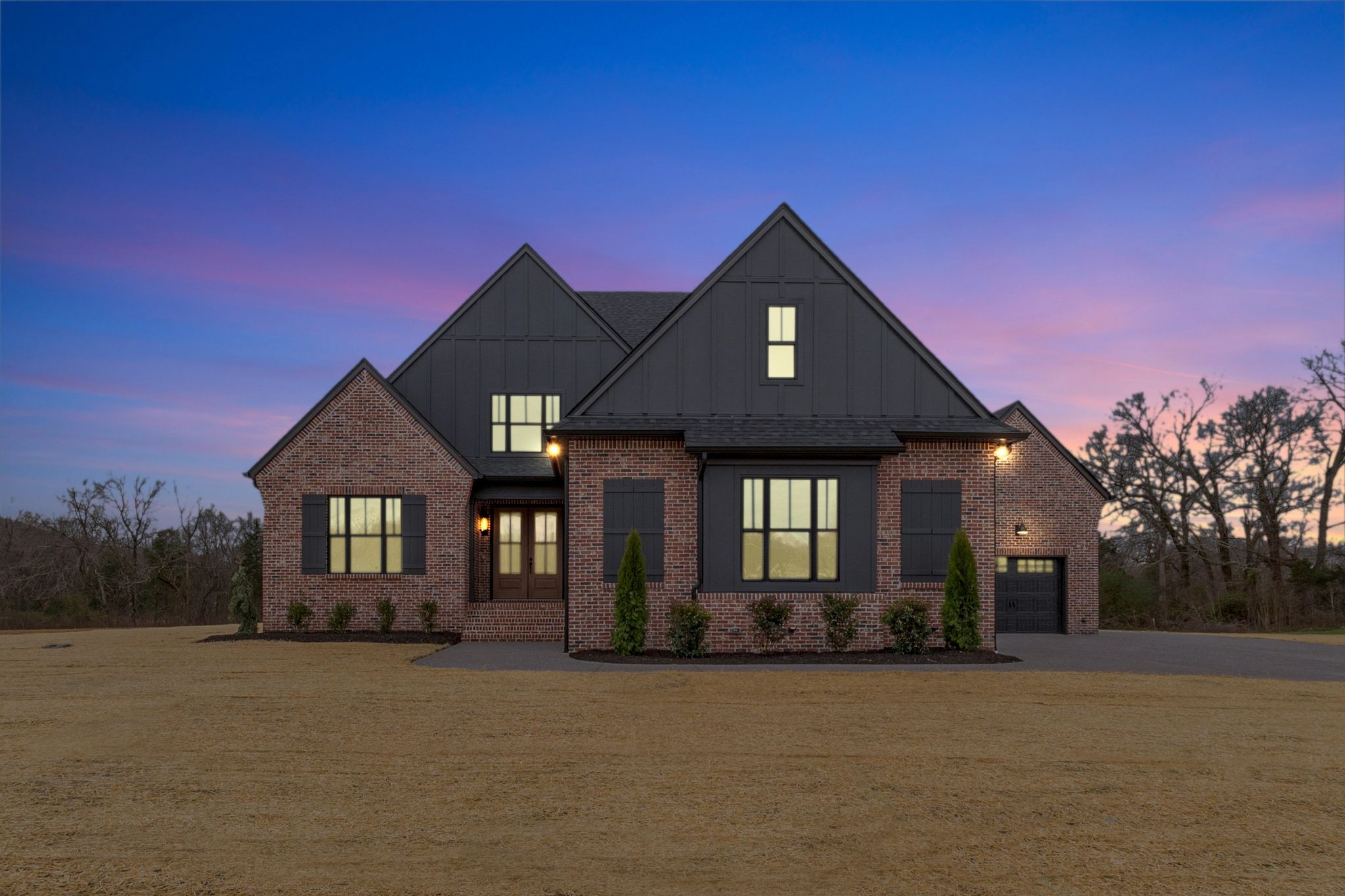 1072 Poplar Hill Road Lebanon, TN 37090 - Photo 2 of 49 a front view of a house with a yard and garage