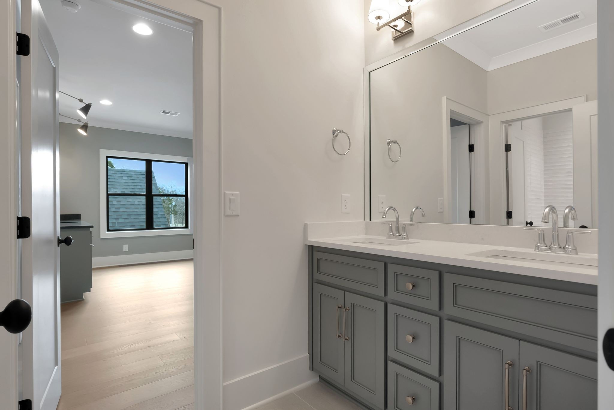 1072 Poplar Hill Road Lebanon, TN 37090 - Photo 35 of 49 a bathroom with a double vanity sink and mirror with shower