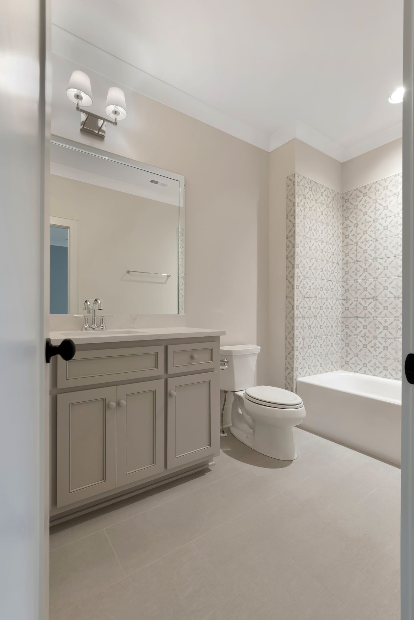 1072 Poplar Hill Road Lebanon, TN 37090 - Photo 40 of 49 a bathroom with a double vanity sink a toilet a mirror and shower