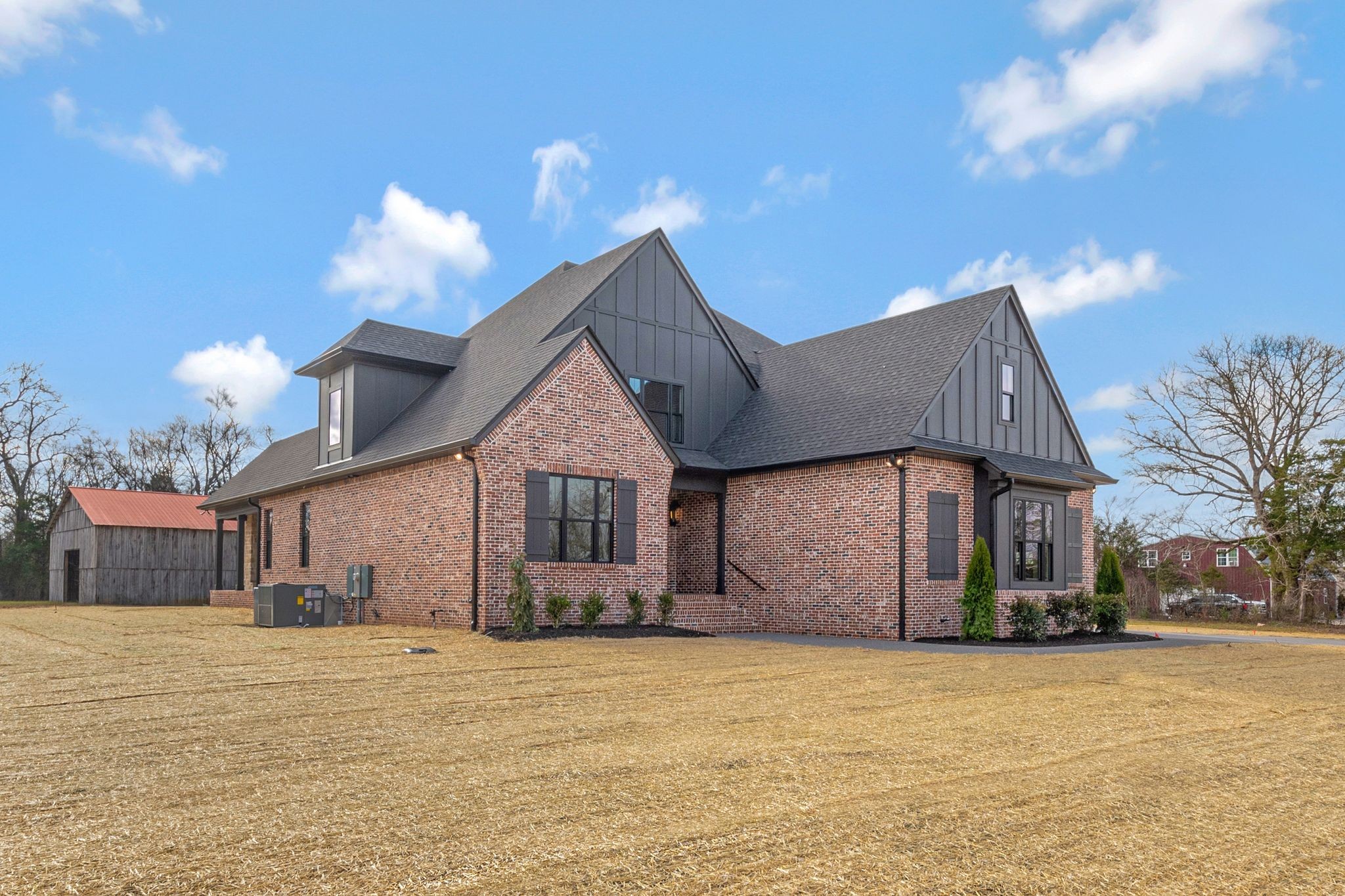 1072 Poplar Hill Road Lebanon, TN 37090 - Photo 4 of 49 a front view of a house with a yard and garage