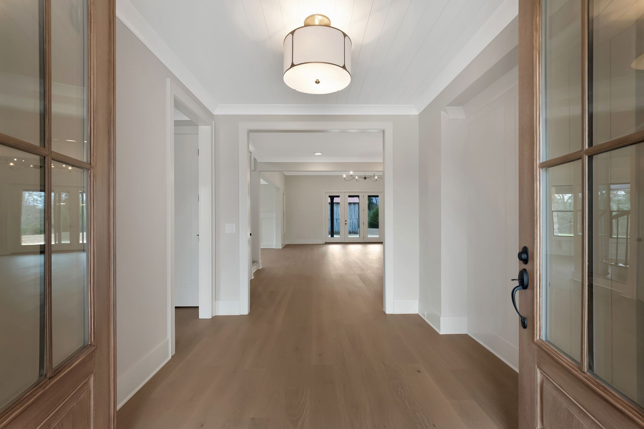 1072 Poplar Hill Road Lebanon, TN 37090 - Photo 6 of 49 a view of a hallway with wooden floor and dining room