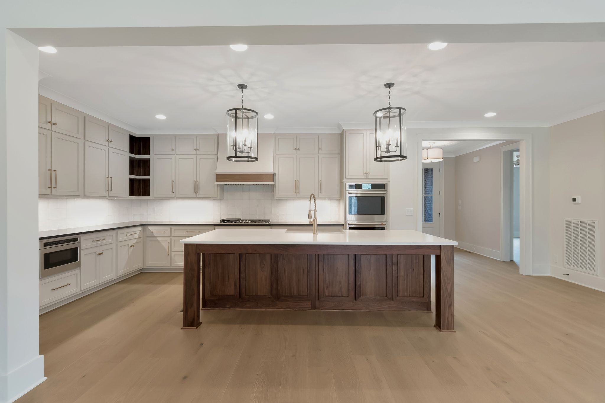 1072 Poplar Hill Road Lebanon, TN 37090 - Photo 10 of 49 a large kitchen with stainless steel appliances kitchen island granite countertop a sink and cabinets