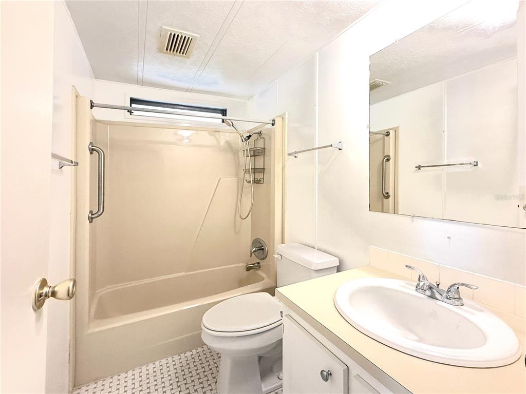 210 North St Thomas Circle Apollo Beach, FL 33572 - Photo 21 of 34 a bathroom with a sink toilet and shower