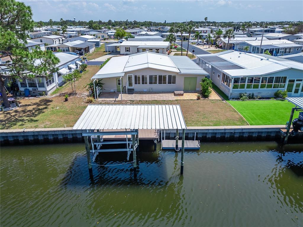 210 North St Thomas Circle Apollo Beach, FL 33572 - Photo 22 of 34 a view of a swimming pool and lounge chair