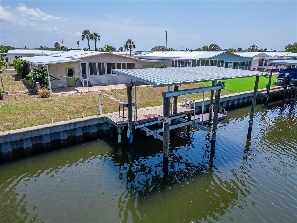 210 North St Thomas Circle Apollo Beach, FL 33572 - Photo 24 of 34 a view of a house with swimming pool and sitting area