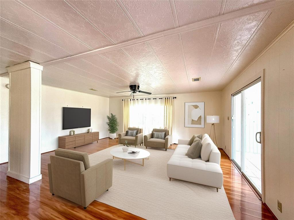 210 North St Thomas Circle Apollo Beach, FL 33572 - Photo 5 of 34 a living room with furniture and a flat screen tv