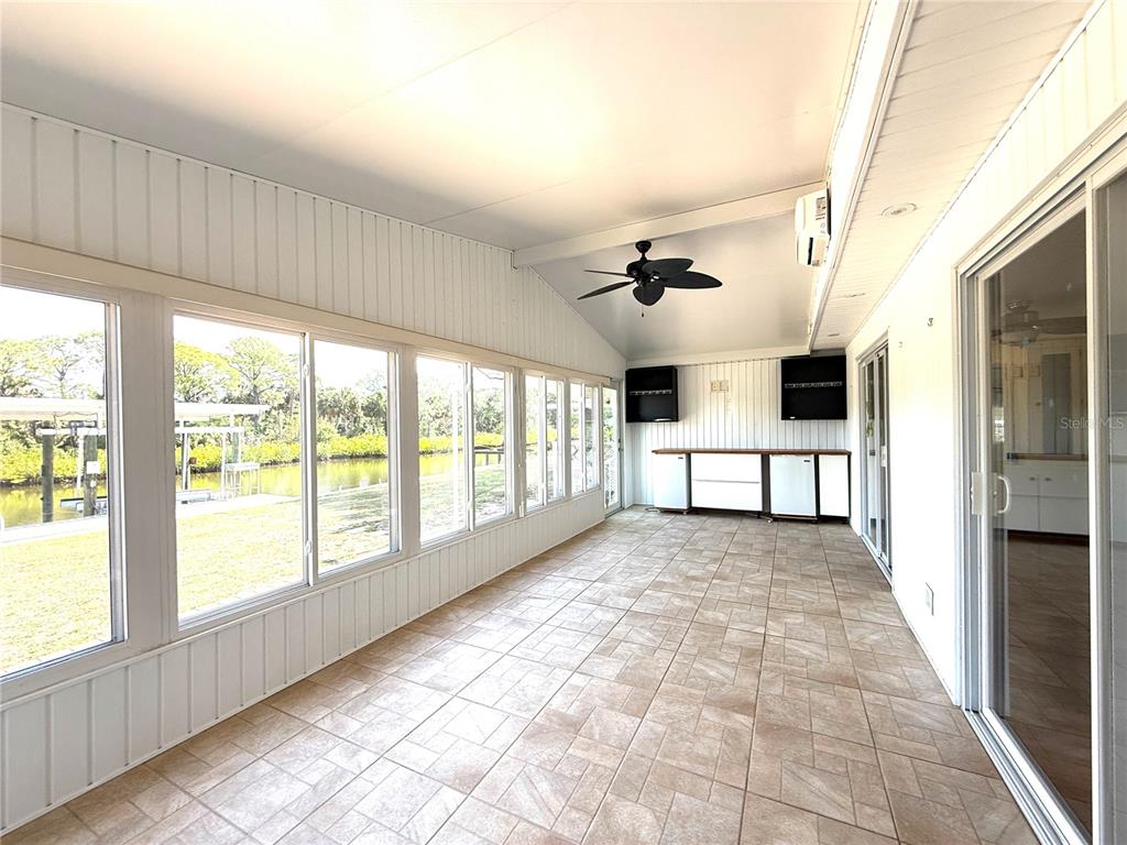 210 North St Thomas Circle Apollo Beach, FL 33572 - Photo 8 of 34 a large white kitchen with stainless steel appliances granite countertop a refrigerator and a stove
