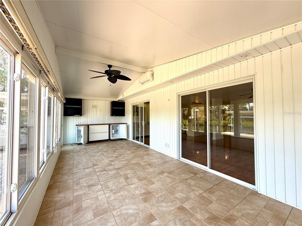 210 North St Thomas Circle Apollo Beach, FL 33572 - Photo 9 of 34 a view of a livingroom with a ceiling fan and window