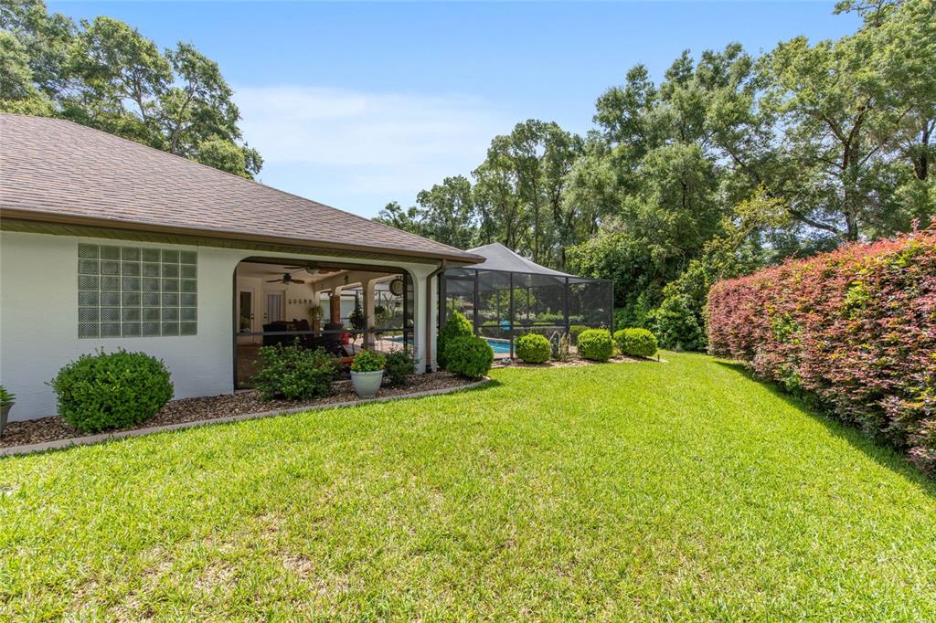 18825 Southwest 93rd Loop Dunnellon, FL 34432 - Photo 61 of 85 a view of a house with backyard and garden