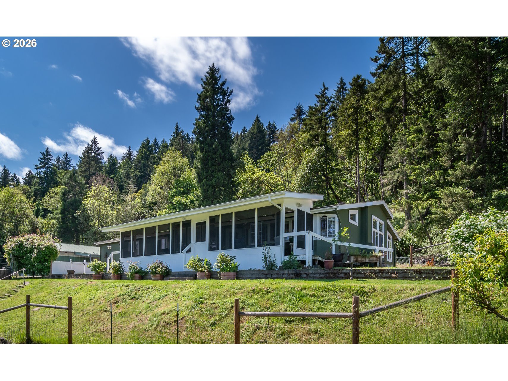562 Valley Road Roseburg, OR 97471 - Photo 1 of 48 a house view with a garden space