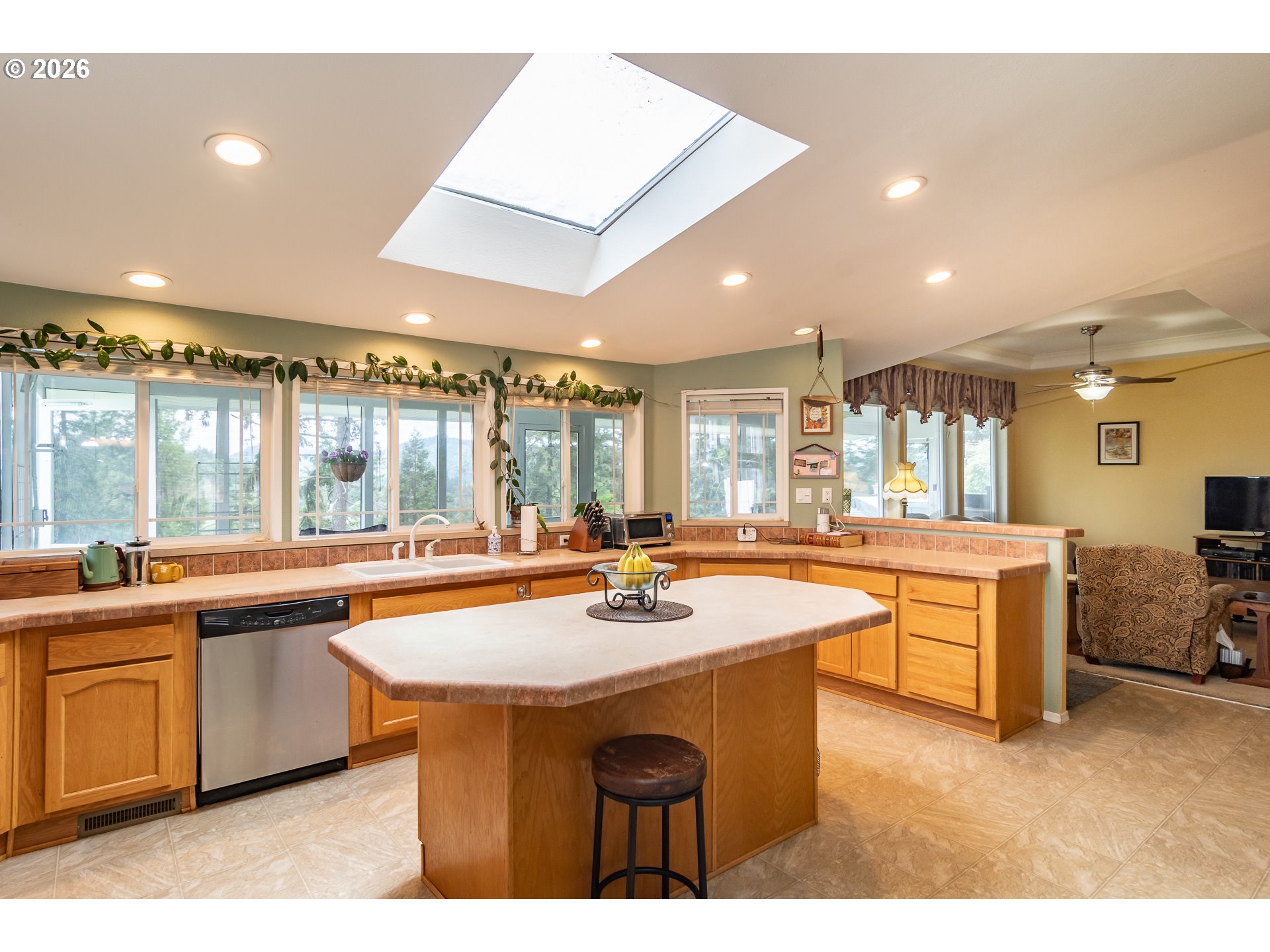 562 Valley Road Roseburg, OR 97471 - Photo 12 of 48 a kitchen with stainless steel appliances granite countertop a sink and cabinets