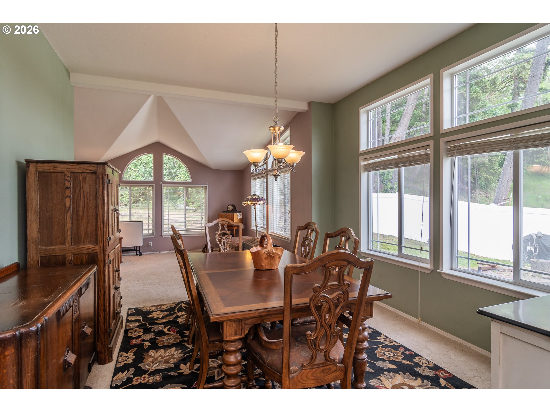 562 Valley Road Roseburg, OR 97471 - Photo 14 of 48 a dining room with furniture a chandelier and wooden floor