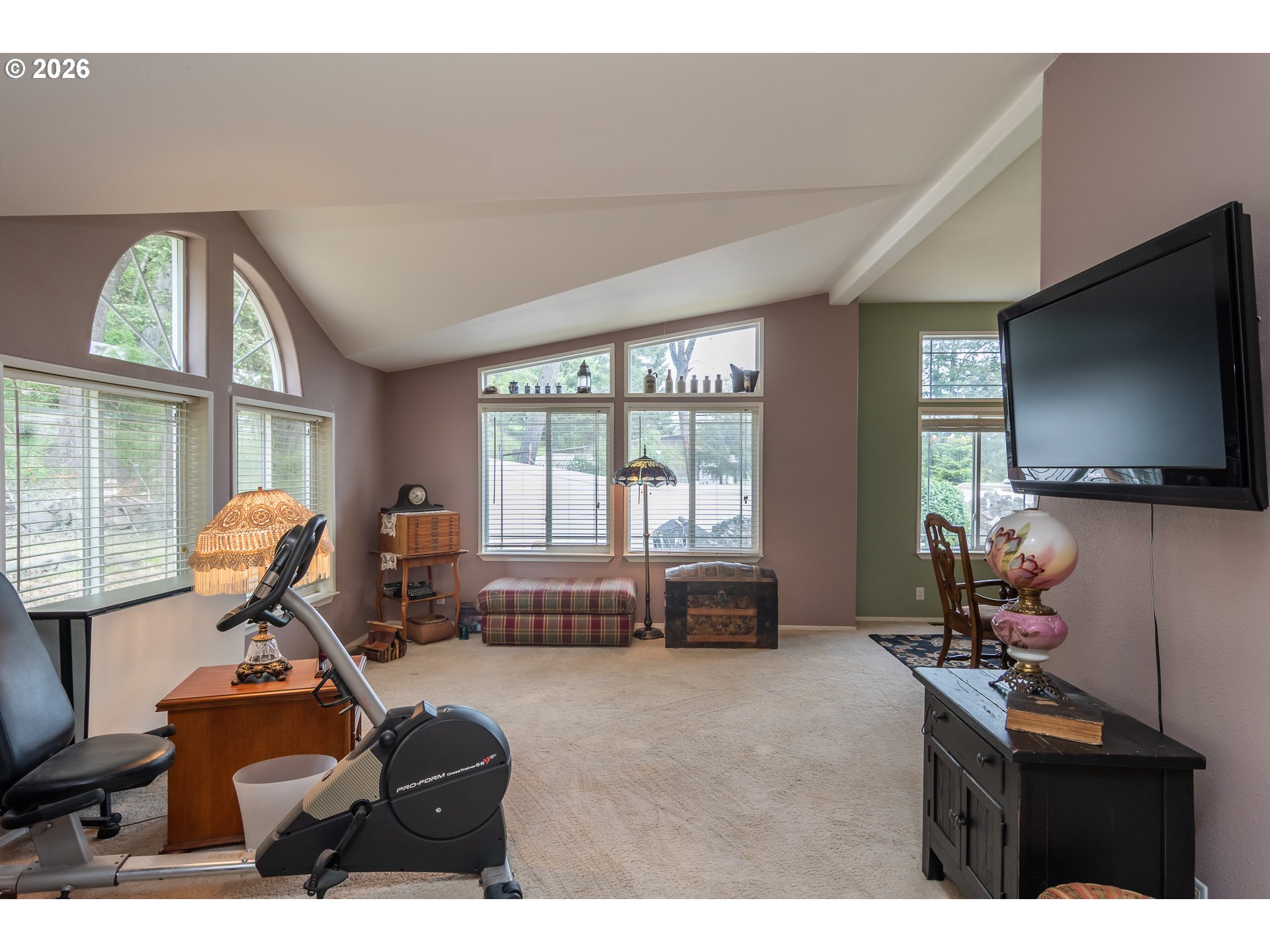 562 Valley Road Roseburg, OR 97471 - Photo 17 of 48 a living room with furniture gym equipment and a large window
