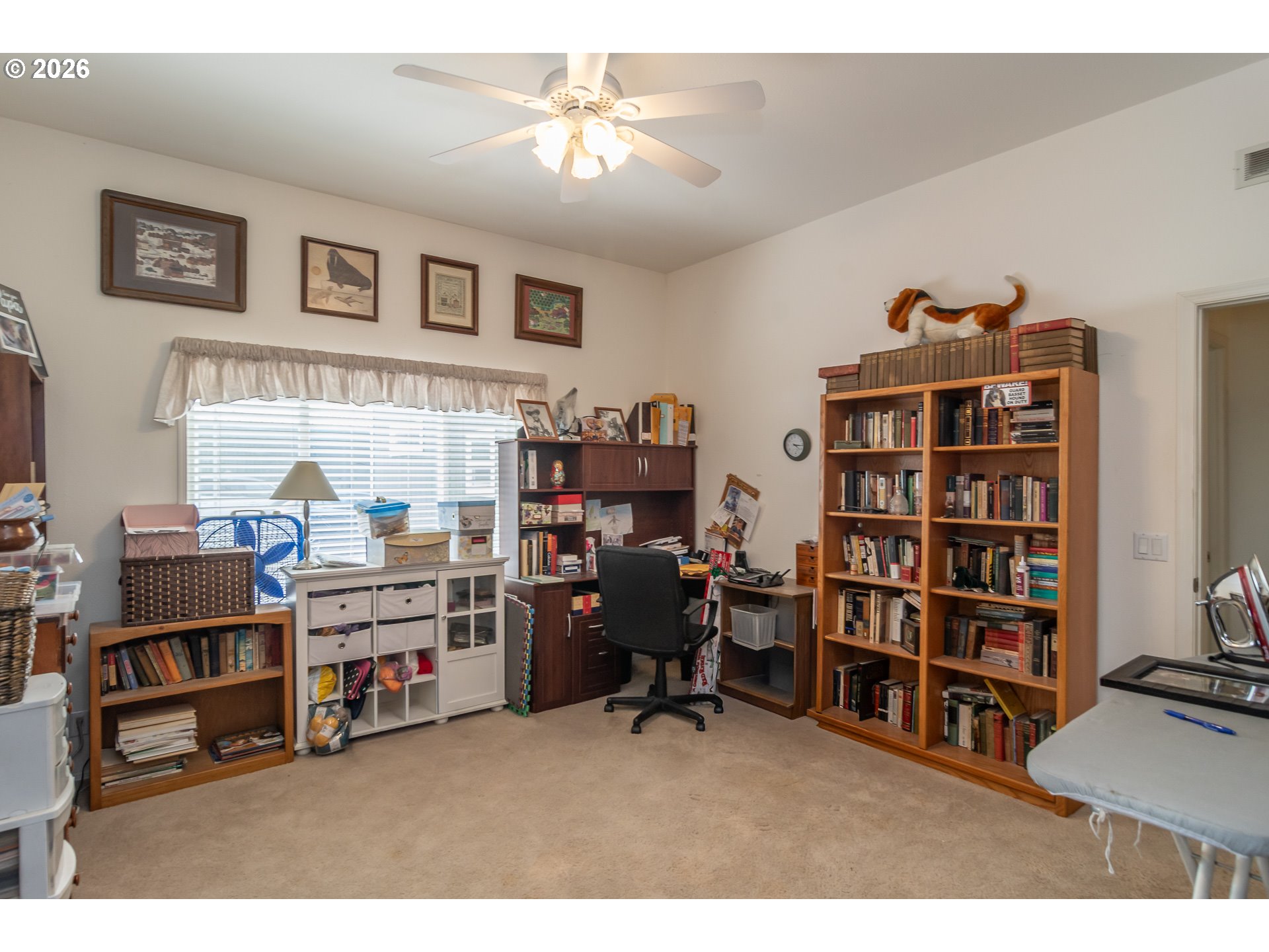 562 Valley Road Roseburg, OR 97471 - Photo 25 of 48 a living room with lots of furniture and a book shelf