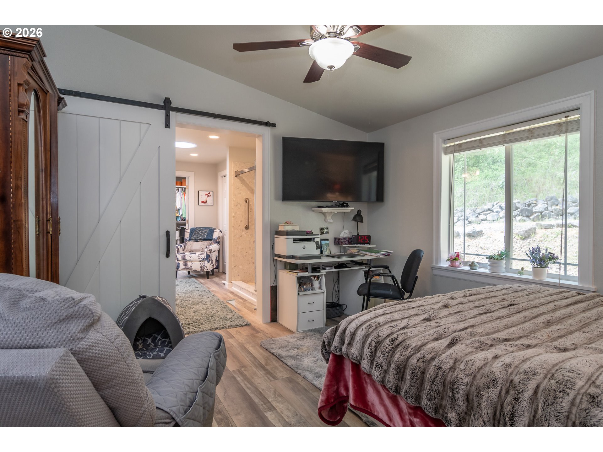 562 Valley Road Roseburg, OR 97471 - Photo 29 of 48 a bedroom with a bed and a flat screen tv