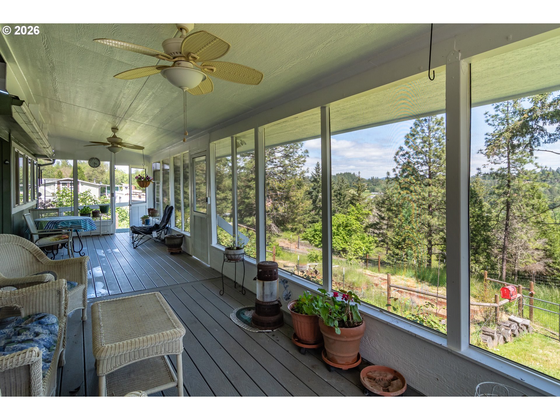 562 Valley Road Roseburg, OR 97471 - Photo 5 of 48 a living room with furniture and a large window