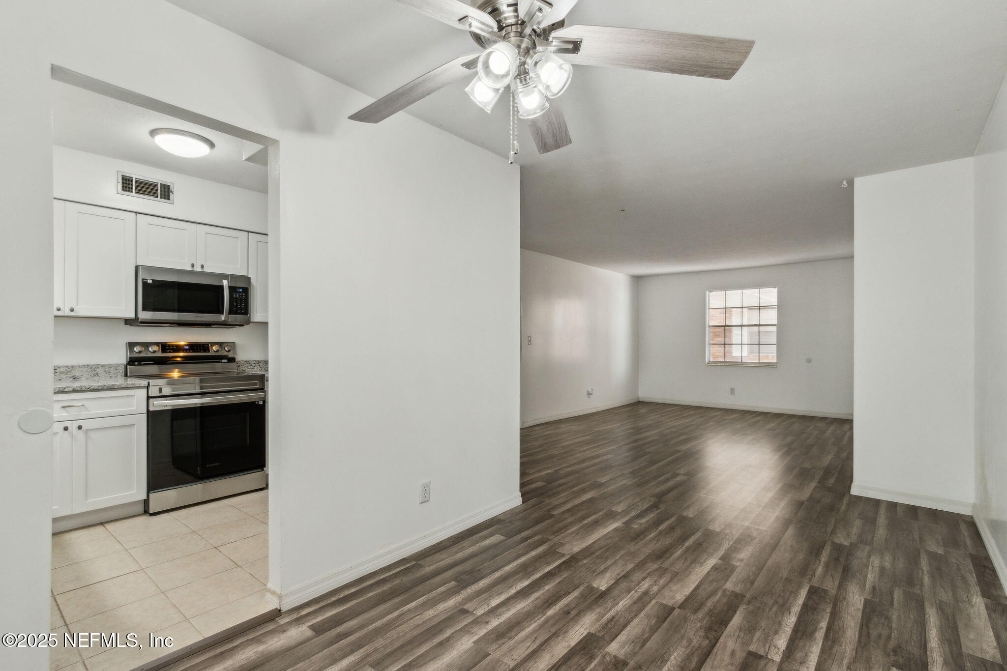 1846 Mallory Street, Unit 8 Jacksonville, FL 32205 - Photo 13 of 25 a view of kitchen with sink microwave and stove top oven