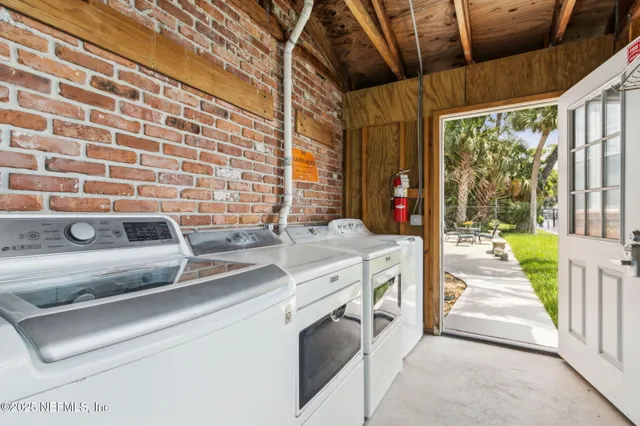 a kitchen with a sink and a stove top oven